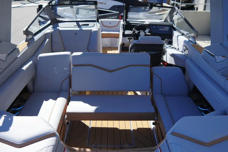 Slide: The Image of 2026 Nautique Super Air Nautique G23 interior with luxurious seating and modern dashboard. - 32