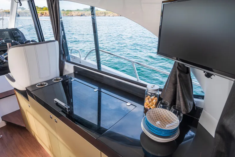 Slide: The Image of Interior of 2025 Beneteau Antares 11 Fly yacht with modern amenities and ocean view. - 12