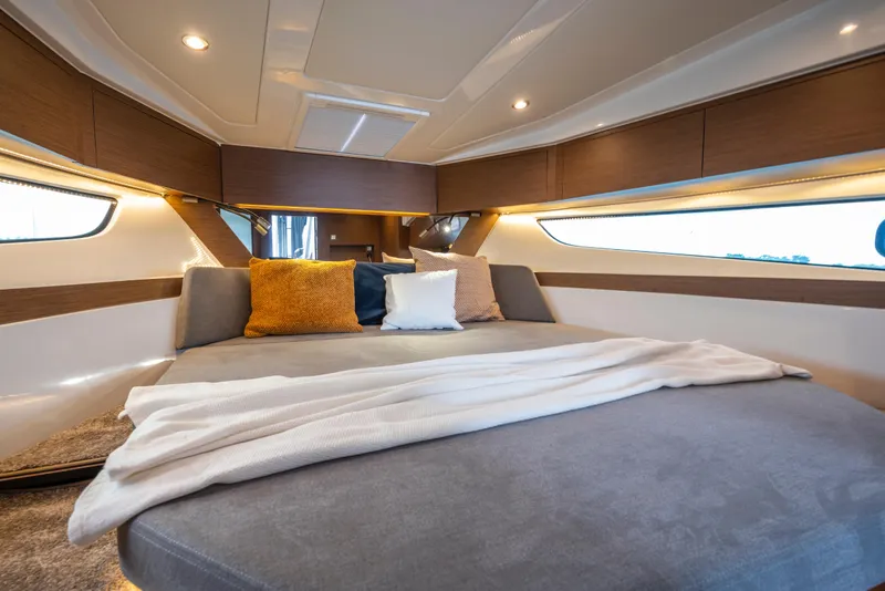 Slide: The Image of Luxurious interior cabin of 2025 Beneteau Antares 11 Fly with cozy bedding. - 13