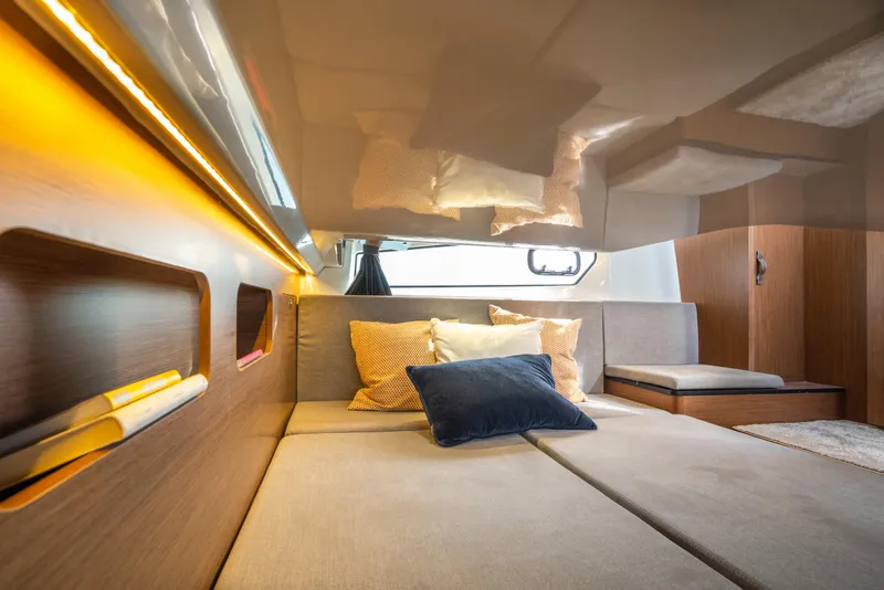Slide: The Image of Luxurious interior cabin of 2025 Beneteau Antares 11 Fly with cozy bedding. - 14