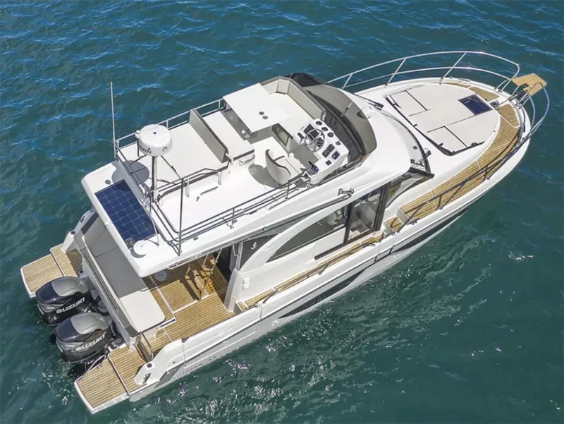 Slide: The Image of 2025 Beneteau Antares 11 Fly yacht on serene blue waters, showcasing luxury design. - 2