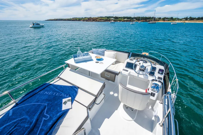 Slide: The Image of 2025 Beneteau Antares 11 Fly yacht with luxurious deck and ocean view. - 24