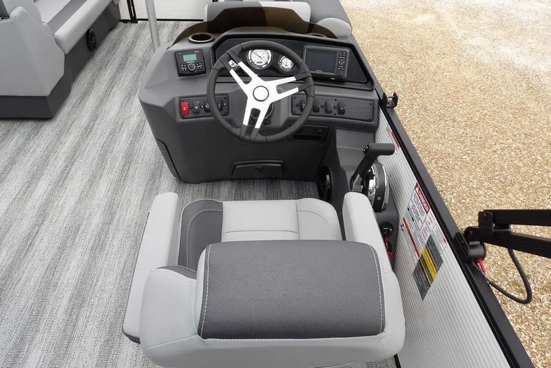 Slide: The Image of 2026 Bennington S Swingback 22 SSB boat helm with modern controls and seating. - 18