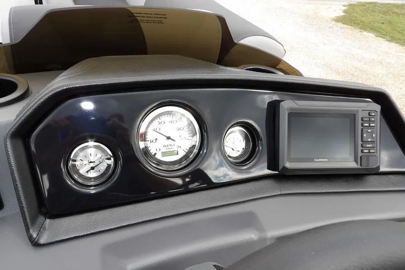 Slide: The Image of Dashboard of 2026 Bennington S Swingback 22 SSB with gauges and Garmin display. - 21