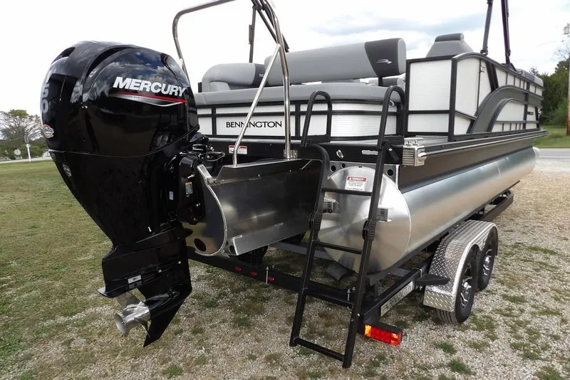 Slide: The Image of 2026 Bennington S Swingback 22 SSB pontoon boat with Mercury outboard engine and trailer. - 38