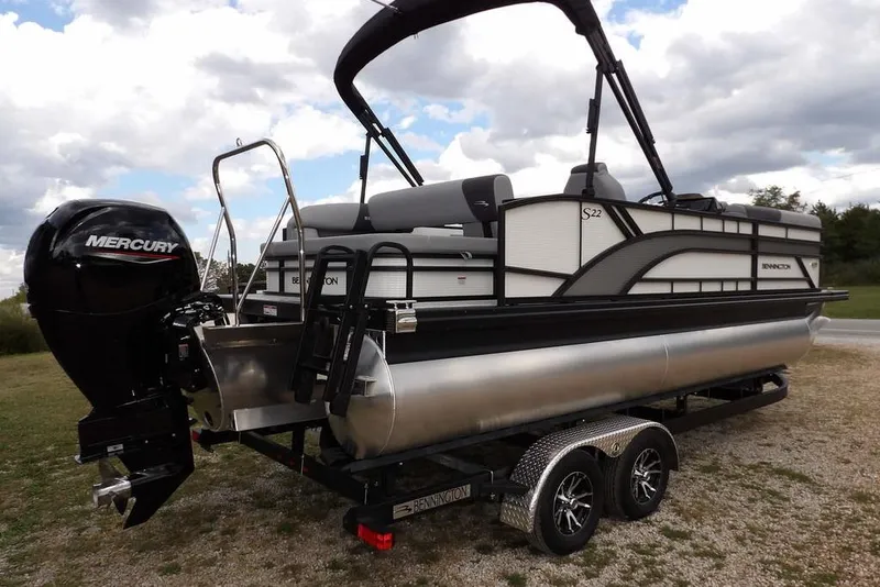Slide: The Image of 2026 Bennington S Swingback 22 SSB pontoon boat with Mercury engine on trailer. - 6
