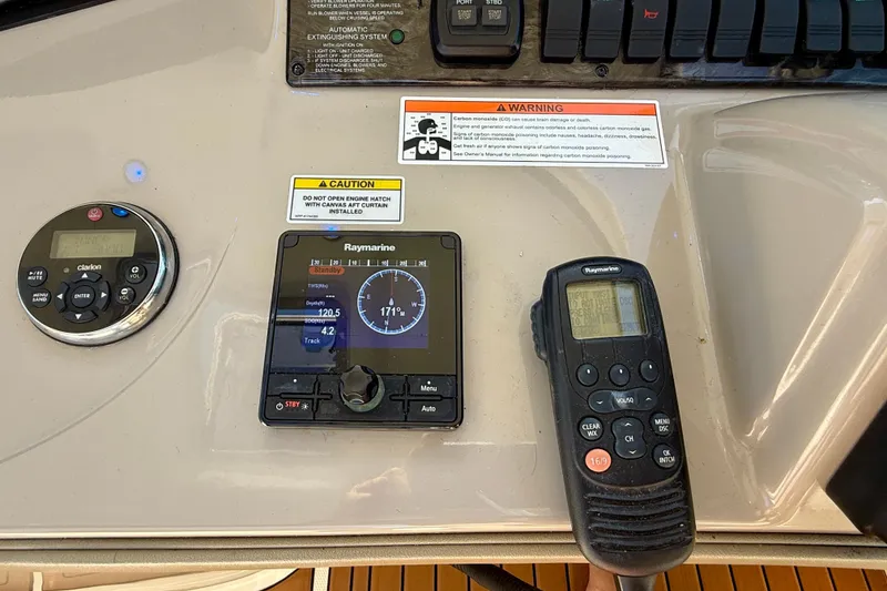 Slide: The Image of Control panel of a 2008 Sea Ray 38 Sundancer with navigation and communication devices. - 11