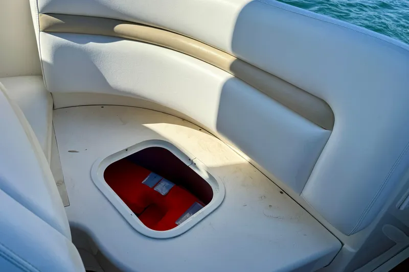 Slide: The Image of 2008 Sea Ray 38 Sundancer boat seating with storage compartment open. - 25