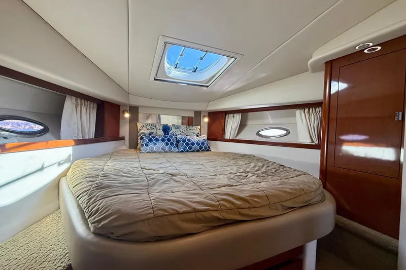 Slide: The Image of Luxurious cabin interior of 2008 Sea Ray 38 Sundancer yacht with skylight and cozy bedding. - 35