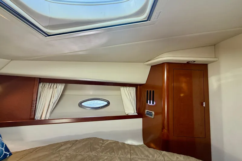 Slide: The Image of Interior cabin of 2008 Sea Ray 38 Sundancer yacht with skylight and wood paneling. - 36