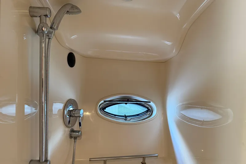 Slide: The Image of Shower area in 2008 Sea Ray 38 Sundancer yacht with porthole window. - 39
