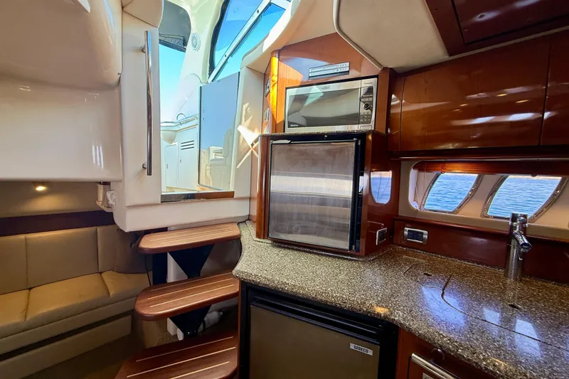 Slide: The Image of Luxurious 2008 Sea Ray 38 Sundancer yacht interior with modern kitchen and seating area. - 41