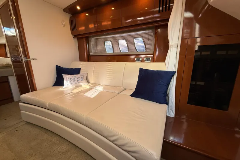 Slide: The Image of Luxurious interior of 2008 Sea Ray 38 Sundancer with cream leather sofa and blue cushions. - 44