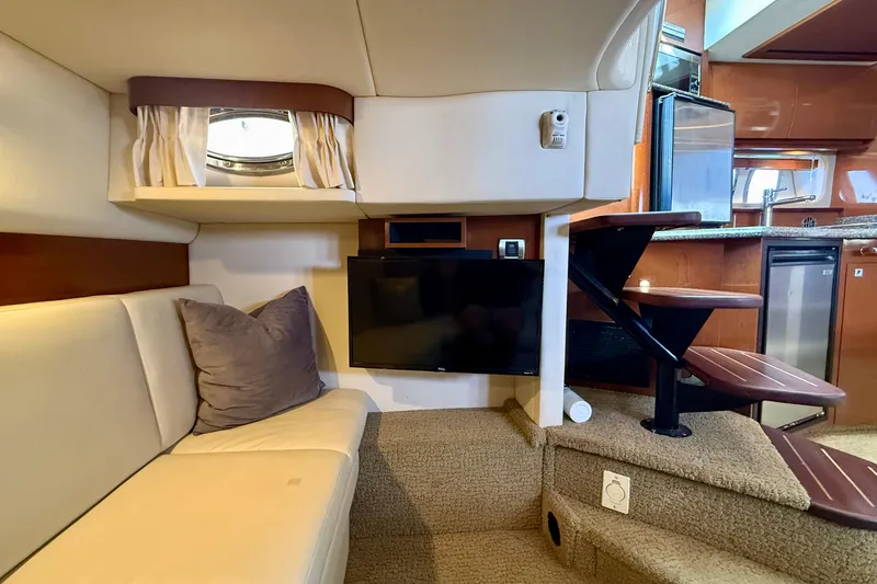 Slide: The Image of Interior of 2008 Sea Ray 38 Sundancer yacht with cozy seating and modern amenities. - 45