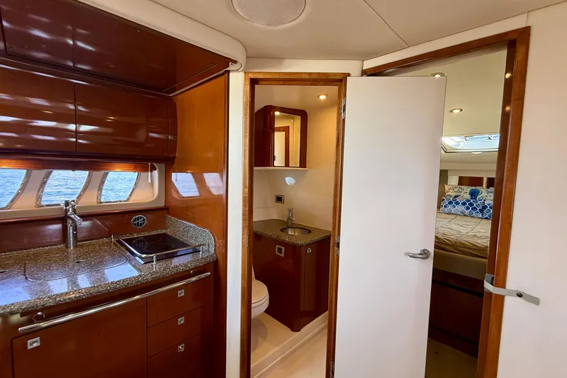 Slide: The Image of Interior of 2008 Sea Ray 38 Sundancer yacht with kitchen, bathroom, and bedroom. - 47
