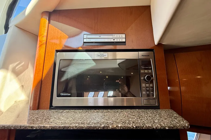 Slide: The Image of Microwave and stereo in 2008 Sea Ray 38 Sundancer yacht kitchen. - 50