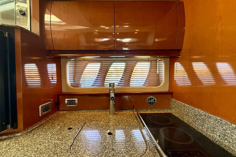 Slide: The Image of Luxurious kitchen interior of 2008 Sea Ray 38 Sundancer yacht with modern amenities. - 52
