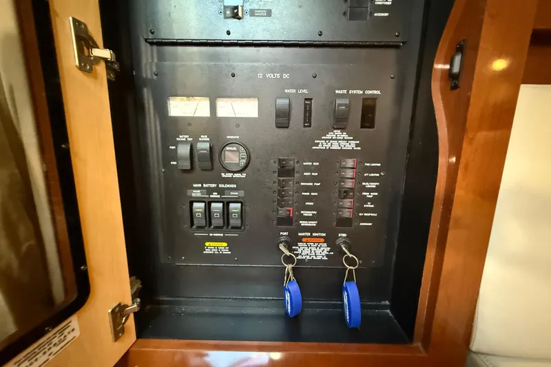 Slide: The Image of Electrical control panel on a 2008 Sea Ray 38 Sundancer boat. - 58