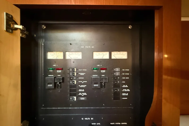 Slide: The Image of Electrical control panel on a 2008 Sea Ray 38 Sundancer boat. - 60