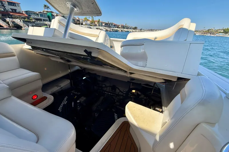 Slide: The Image of 2008 Sea Ray 38 Sundancer boat with open engine compartment, showcasing Mercury engine. - 61