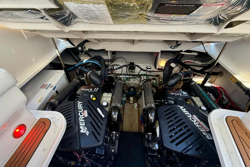 Slide: The Image of Engine compartment of a 2008 Sea Ray 38 Sundancer with twin Mercury engines. - 62