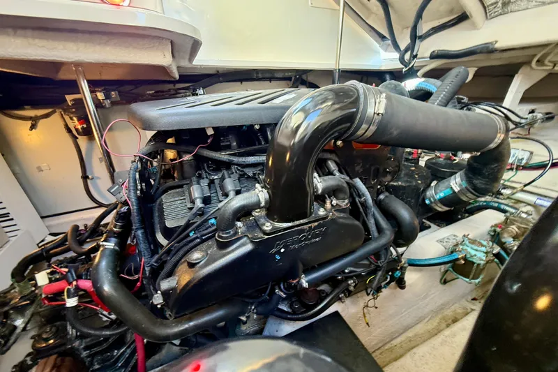 Slide: The Image of Engine compartment of a 2008 Sea Ray 38 Sundancer boat, showcasing detailed components. - 63