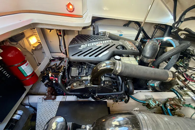 Slide: The Image of Engine room of a 2008 Sea Ray 38 Sundancer with Mercury engine and safety equipment. - 64