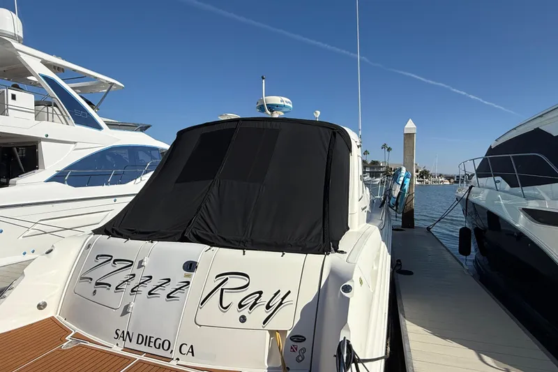 Slide: The Image of 2008 Sea Ray 38 Sundancer docked in San Diego marina under clear blue sky. - 66