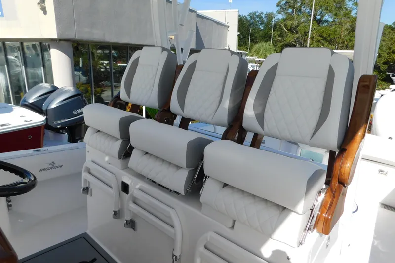 Slide: The Image of 2026 Regulator 35 boat with luxurious white seating and Yamaha engines. - 10