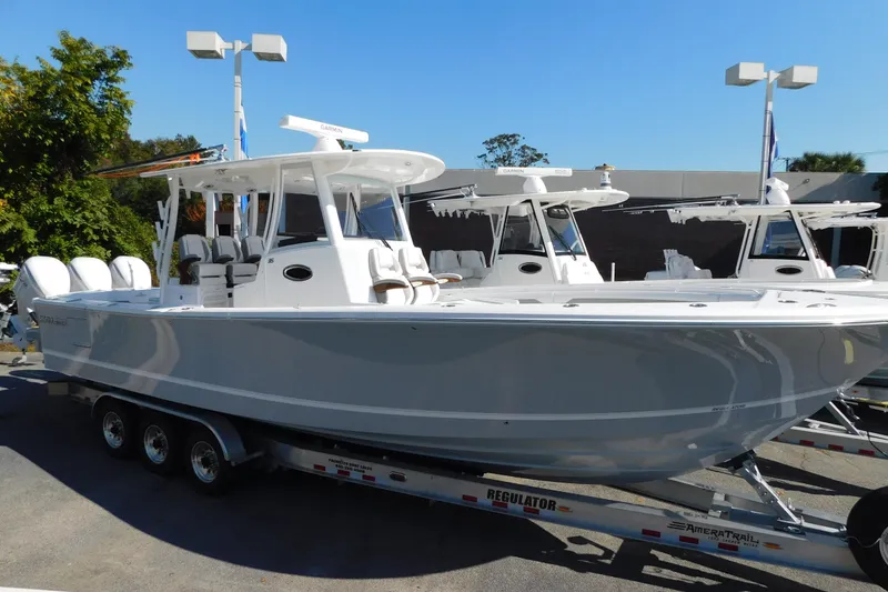 Slide: The Image of 2026 Regulator 35 boat on trailer, sleek design, parked outdoors. - 105