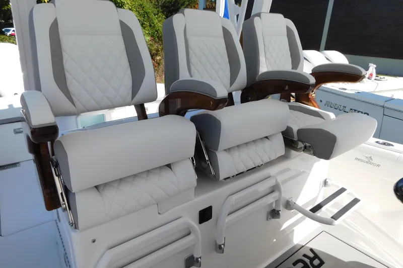 Slide: The Image of Luxury seating on 2026 Regulator 35 boat, featuring plush, diamond-stitched upholstery. - 11