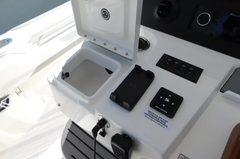Slide: The Image of Control panel of 2026 Regulator 35 boat with storage compartment and electronic controls. - 15