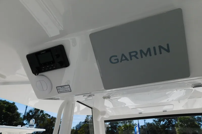 Slide: The Image of 2026 Regulator 35 boat interior with Garmin electronics display. - 18