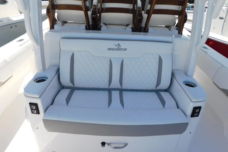 Slide: The Image of Luxury seating on 2026 Regulator 35 boat with quilted upholstery and cup holders. - 19