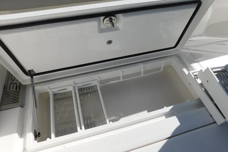 Slide: The Image of Open storage compartment on a 2026 Regulator 35 boat, showcasing interior space. - 27