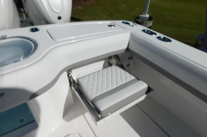 Slide: The Image of 2026 Regulator 35 boat interior with cushioned seating and cup holders. - 28