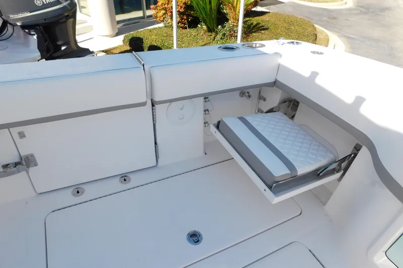 Slide: The Image of 2026 Regulator 35 boat with foldable seat and Yamaha engine in a sleek white design. - 29