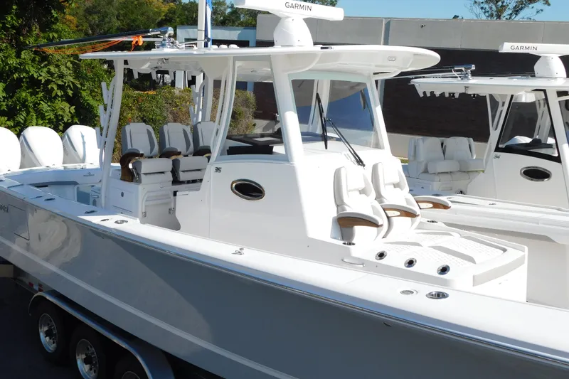 Slide: The Image of 2026 Regulator 35 boat with sleek design and advanced features, docked outdoors. - 3