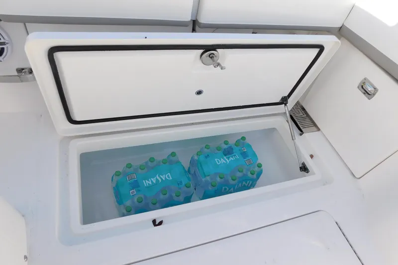 Slide: The Image of Built-in cooler on 2026 Regulator 35 boat with bottled water storage. - 30