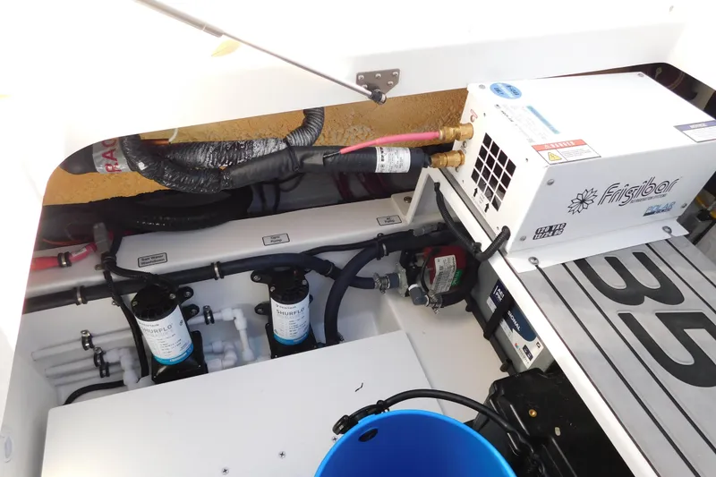 Slide: The Image of Engine compartment of 2026 Regulator 35 boat with Frigibar unit and Shurflo pumps. - 34
