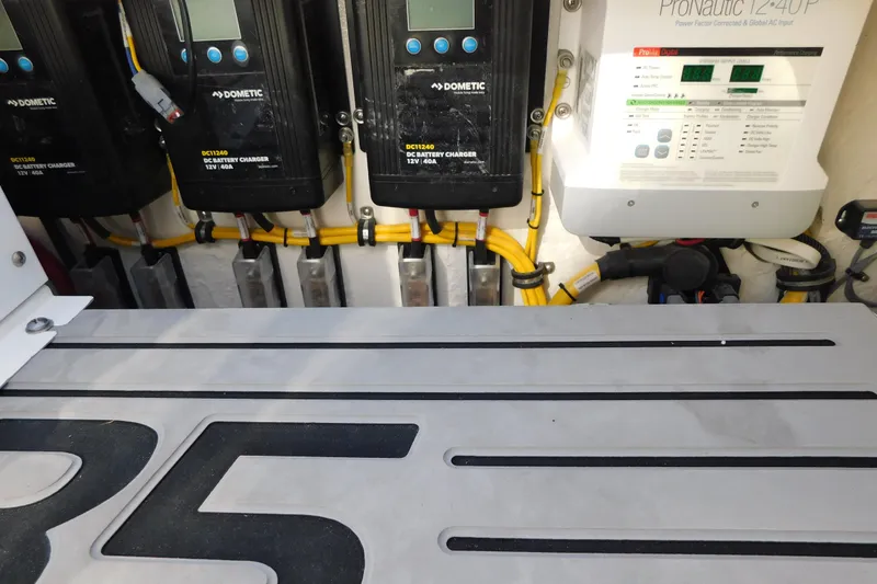 Slide: The Image of Electrical system of a 2026 Regulator 35 boat with battery chargers and wiring. - 35