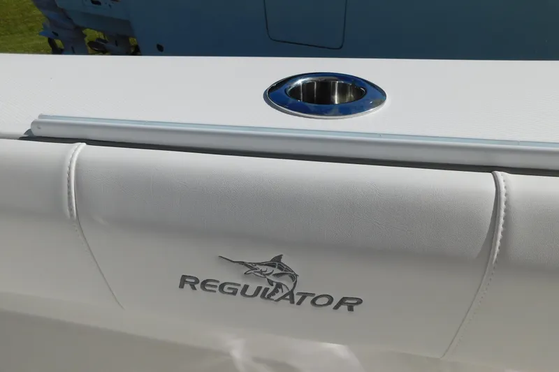 Slide: The Image of 2026 Regulator 35 boat with logo and stainless steel cup holder. - 40
