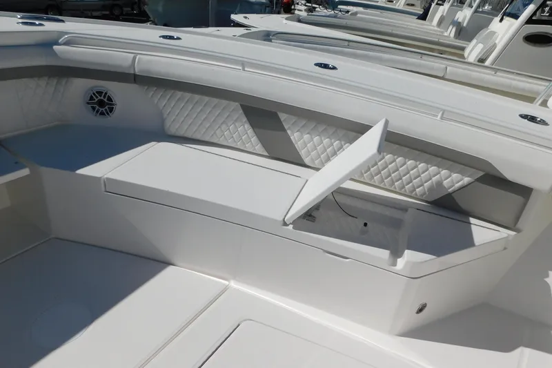 Slide: The Image of 2026 Regulator 35 boat interior with open storage compartment and quilted seating. - 42