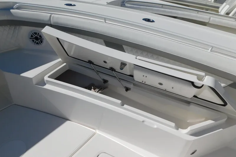 Slide: The Image of 2026 Regulator 35 boat storage compartment open, showcasing spacious interior design. - 43