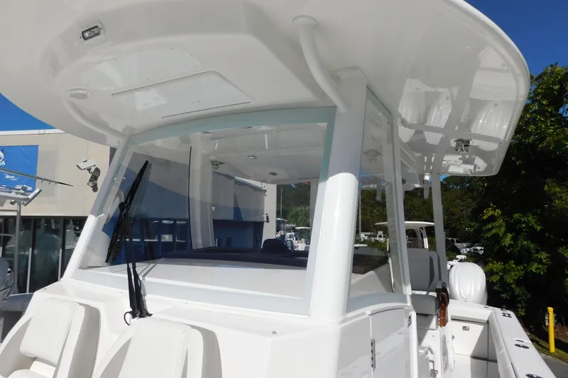 Slide: The Image of 2026 Regulator 35 boat with sleek white design and modern cockpit features. - 46