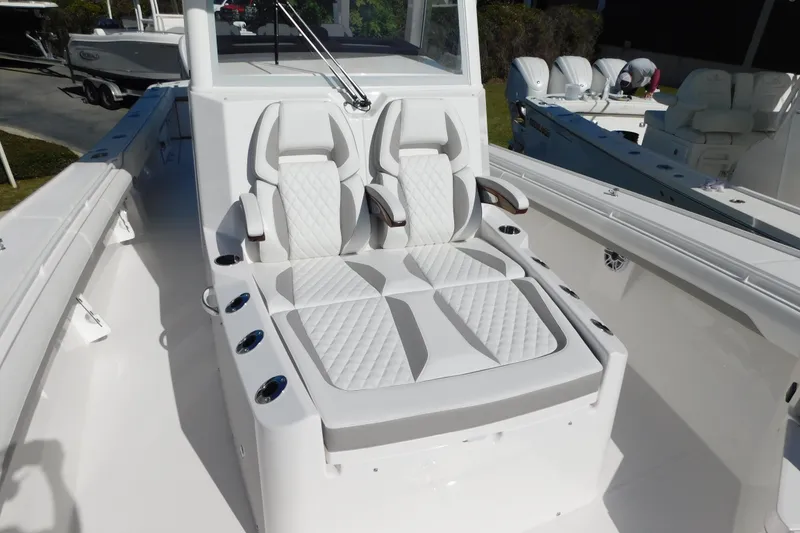 Slide: The Image of 2026 Regulator 35 boat with luxurious white seating and sleek design. - 47