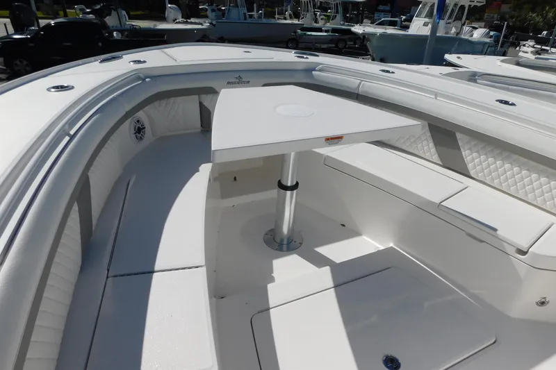 Slide: The Image of 2026 Regulator 35 boat interior with seating and table, showcasing luxury design. - 50