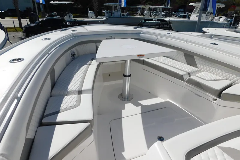 Slide: The Image of 2026 Regulator 35 boat interior with white seating and table, showcasing luxury design. - 51