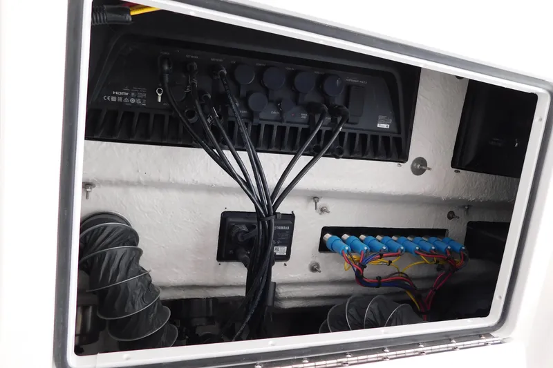 Slide: The Image of Electrical panel inside 2026 Regulator 35 boat, featuring wiring and connections. - 61
