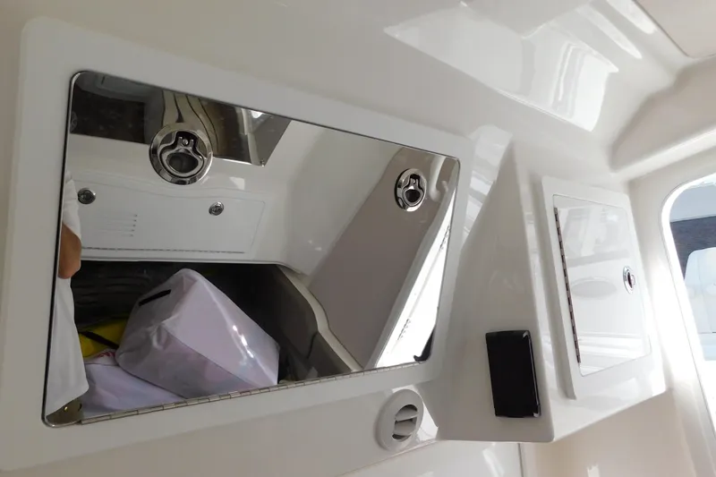 Slide: The Image of Interior of 2026 Regulator 35 boat showing storage compartments and sleek design. - 62